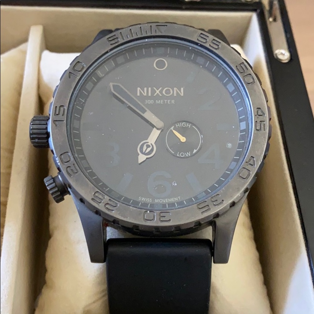 Matte black Nixon watch with black rubber band